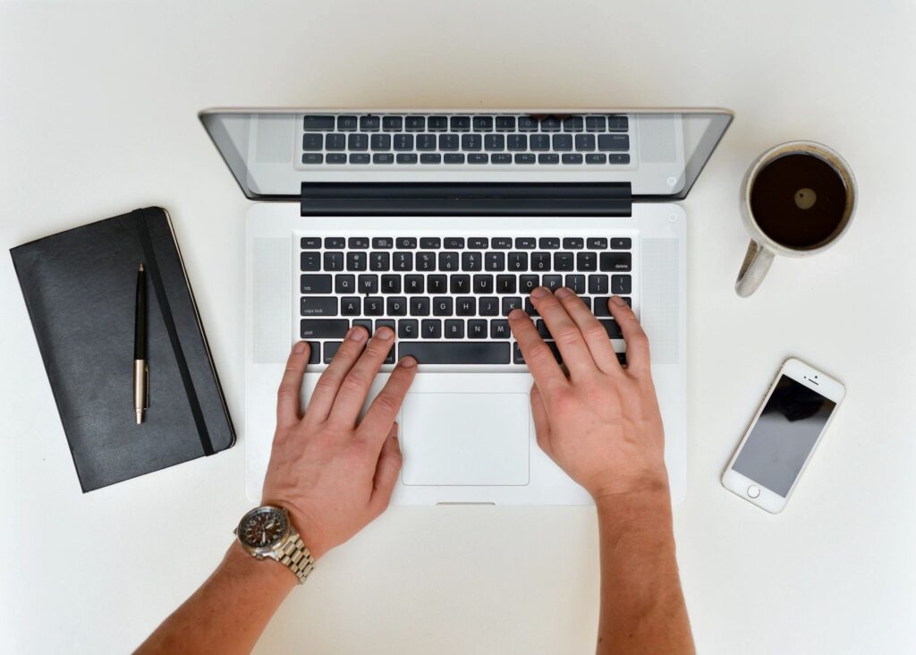 Person typing on laptop